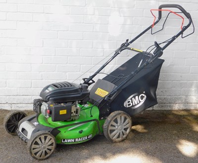 Lot 555 - A BMC 139cc petrol lawnmower, with a Wolf...