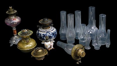 Lot 525 - A group of oil lamp related items, to include...