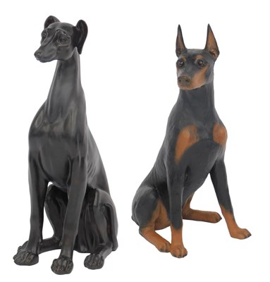 Lot 532 - A resin model of a Dobermann, in seated pose,...