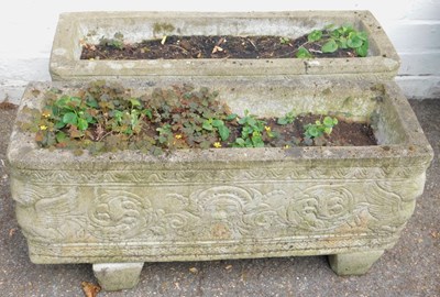 Lot 557 - A pair of composition stone garden planters,...
