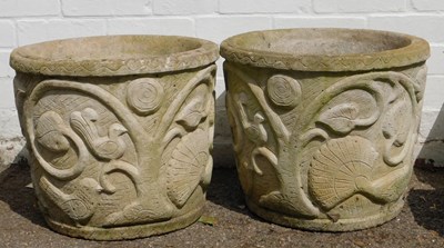 Lot 564 - A pair of composition stone garden planters,...
