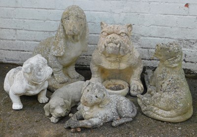 Lot 571 - A group of composition stone garden ornaments,...