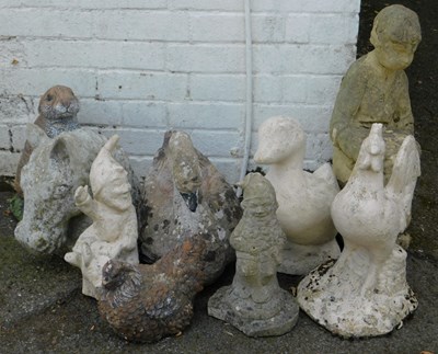 Lot 572 - A group of composition stone garden ornaments,...