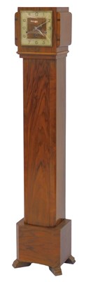 Lot 585 - A 1930s walnut cased Grandmother clock, the...