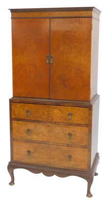 Lot 611 - A Queen Anne style walnut tallboy, the top...