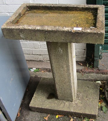 Lot 1102 - A concrete birdbath, plinth to base, plinth to...