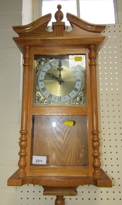 Lot 2211 - A Daniel Dakota oak cased wall clock.