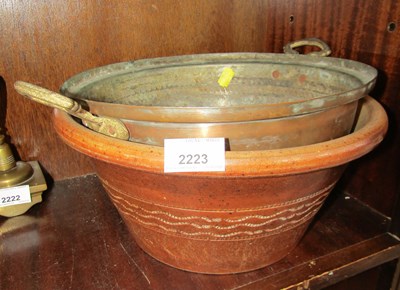 Lot 2223 - A brass preserve pan and a terracotta bowl. (2)
