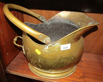Lot 2224 - A brass helmet-shaped coal scuttle.