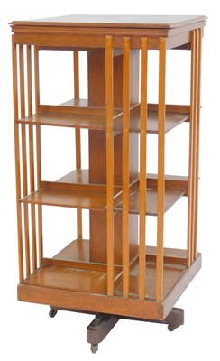 Lot 624 - An early 20thC oak revolving bookcase, the top...