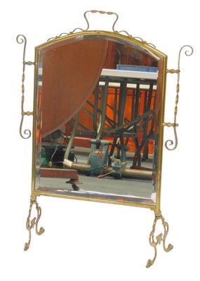 Lot 631 - A Victorian brass framed fire screen, with...