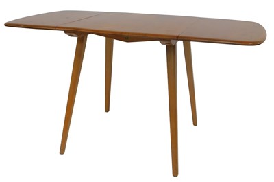 Lot 632 - An Ercol light elm drop leaf kitchen table, on...