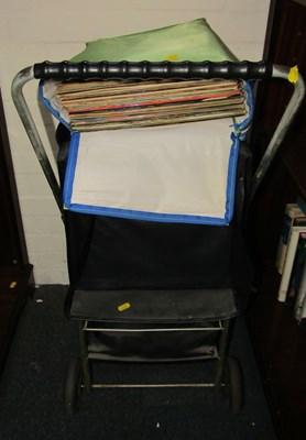 Lot 2237 - A shopping trolley, together with vinyl LPs,...