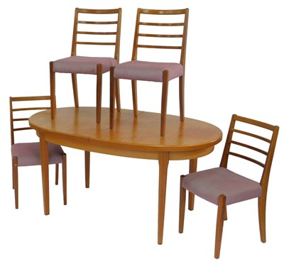 Lot 640 - A 1970s teak extending dining table, the oval...