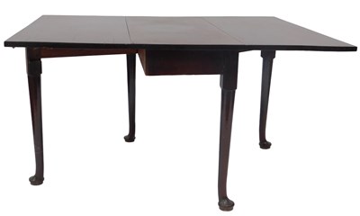 Lot 642 - A George III mahogany drop leaf dining table,...