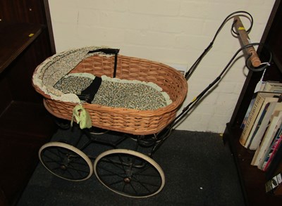 Lot 2243 - A child's wicker doll's pram.