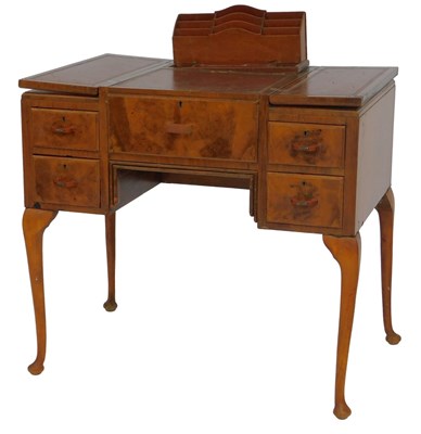 Lot 651 - An Art Deco walnut metamorphic desk, the...