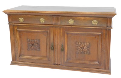 Lot 668 - An early 20thC oak sideboard, the top with a...