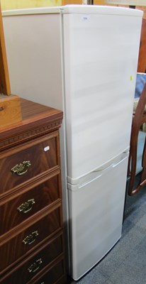 Lot 1059 - A fridge freezer.