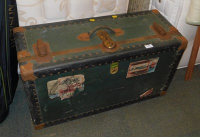 Lot 1064 - A vintage travelling trunk.
