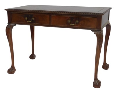 Lot 681 - An early 20thC mahogany desk, the top inset...