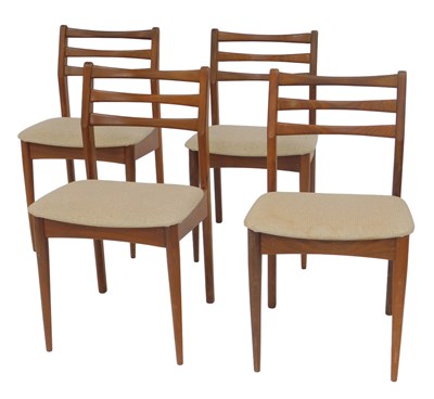 Lot 685 - A set of four 1970s teak ladderback dining...