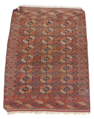 Lot 695 - A Tekke Turkmen red ground rug, with three...