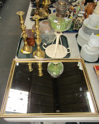 Lot 2244 - An oil lamp raised on a metal circular base, a...