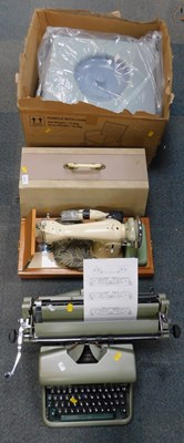 Lot 2272 - An electric sewing machine, boxed, a manual...