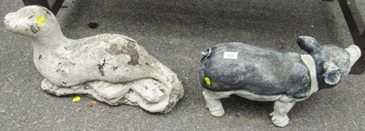 Lot 1139 - Two garden ornaments, comprising an otter and...