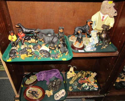 Lot 2291 - A group of ceramic and resin dog ornaments,...