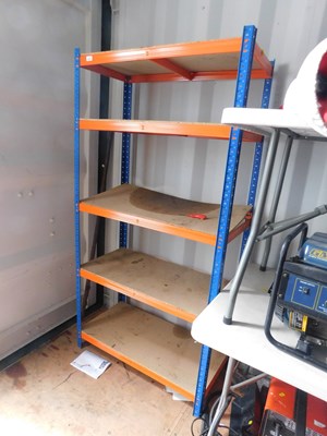 Lot 1140 - A metal and wooden shelving unit.