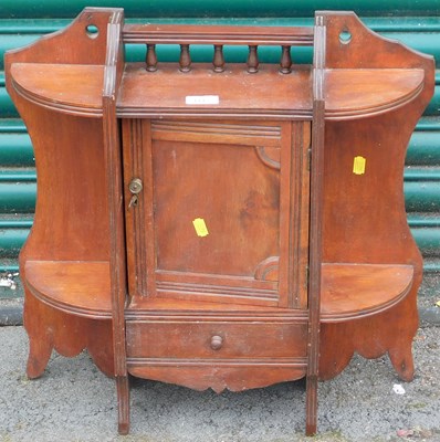 Lot 1142 - A wall hanging cabinet, with single door over...