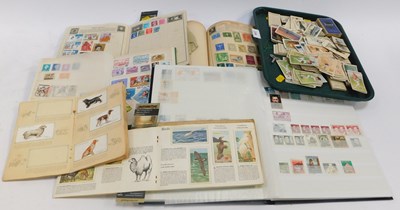 Lot 2296 - Four stamp albums and contents of stamps,...