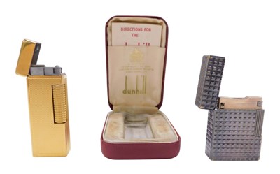Lot 301 - Two lighters, comprising a gold plated Dunhill...
