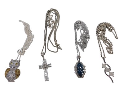 Lot 336 - Four silver pendants and chains, each stone...
