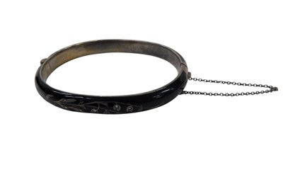 Lot 338 - An Edwardian bangle, on black jet band, with...