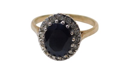 Lot 113 - A 9ct gold sapphire and diamond dress ring,...