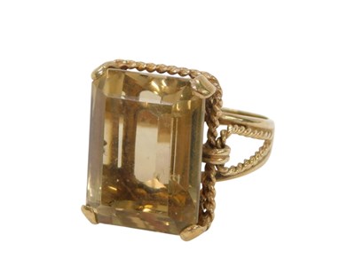 Lot 116 - A 9ct gold smokey quartz dress ring, the...