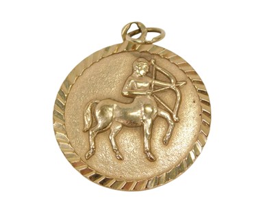 Lot 117 - A 9ct gold pendant, the etched style border...