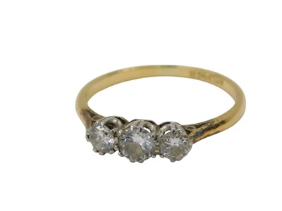 Lot 435 - A diamond three stone dress ring, the centre...