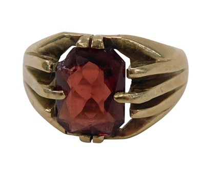 Lot 390 - A 9ct gold garnet dress ring, the asher cut...