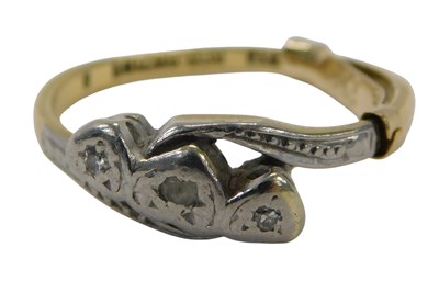 Lot 391 - A diamond three stone twist ring, illusion set...