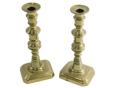 Lot 445 - A pair of 20thC brass candlesticks, each on...
