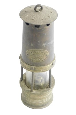 Lot 455 - An early 20thC miner's lamp, bearing plaque...