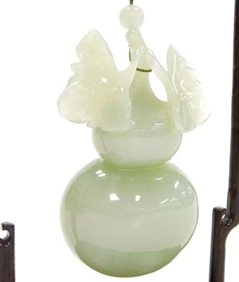 Lot 31 - A 20thC Chinese jade carving of a gourd, with...