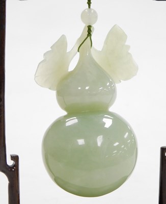Lot 31 - A 20thC Chinese jade carving of a gourd, with...