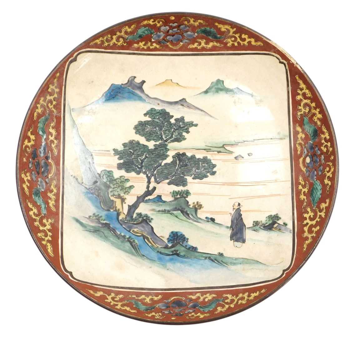 Lot 25 - A Japanese Meiji period Kutani dish, decorated...
