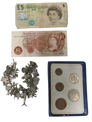Lot 196 - A silver charm bracelet, with curb link,...