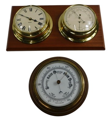 Lot 587 - An early 20thC aneroid barometer, in oak case,...